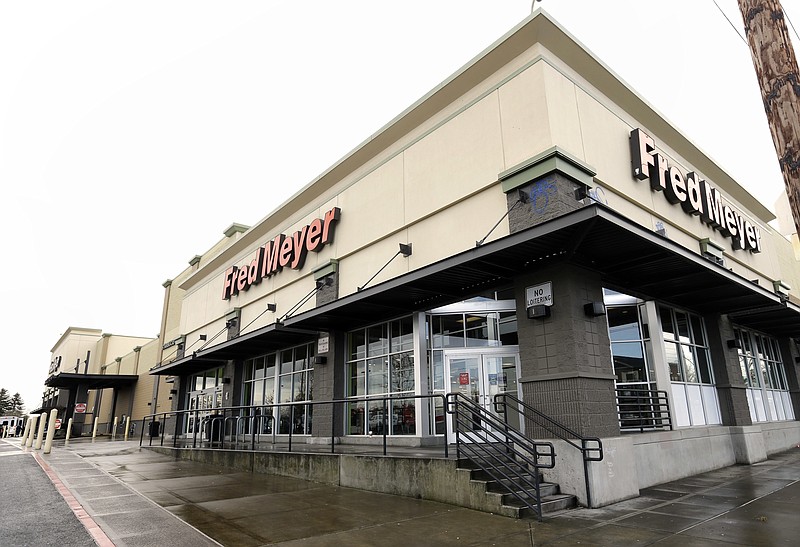 FILE - This March 1, 2018 file photo shows a Fred Meyer store is shown in Portland, Ore., Thursday, March 1, 2018.  The Superstore company says it will stop selling guns and ammunition.  The Portland, Oregon,-based chain in an announcement Friday, March 16 says it made the decision after evaluating customer preferences. The company has more than 130 stores in Oregon, Washington, Idaho and Alaska.   (AP Photo/Don Ryan)