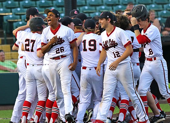 Jefferson City pitcher Joseph Travis (26) celebrates after Gaven Strobel hit a home run during the Class 5 state semifinal game against Lee's Summit last season in O'Fallon. Travis enters the season as Jefferson City's top pitcher.