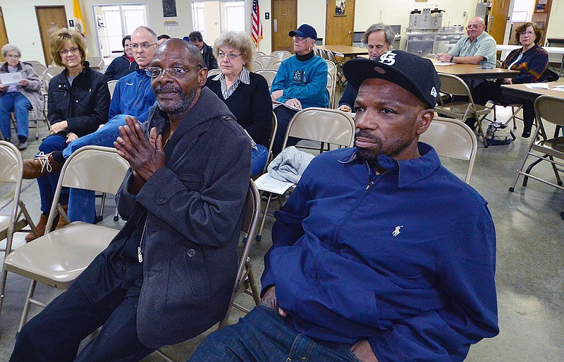 Death row exonerees Joe Amrine, left, and Reggie Griffin wait to speak Saturday during an event at St. Joseph Cathedral School. They talked about their experiences and inequality in the justice system. Griffin spent 23 years on death row and Amrine did 17 for crimes they did not commit. 