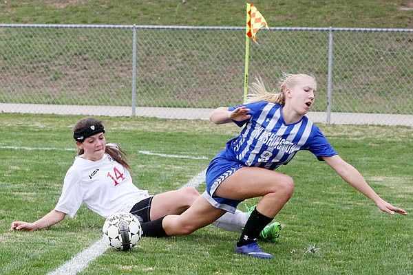 Kenzie Gourley of Jefferson City battles a Washington High School player for the ball near the sideline during a game last season at the 179 Soccer Park. Gourley is one of three seniors this season for the Lady Jays.