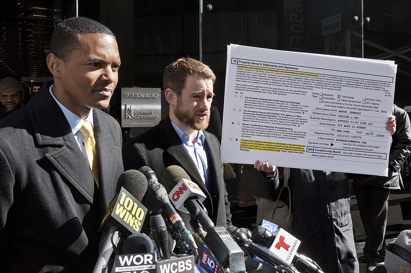 New York City Council Member Ritchie Torres, left, and Housing Rights Initiative Executive Director Aaron Carr address a news conference outside Kushner Companies headquarters, in New York, Monday, March 19, 2018. The pair called for an investigation into a report by AP and a tenants' rights watchdog that Jared Kushner's family real estate company routinely filed false paperwork declaring it had zero rent-regulated tenants in dozens of buildings it owned in New York when it actually had hundreds. (AP Photo/Richard Drew)