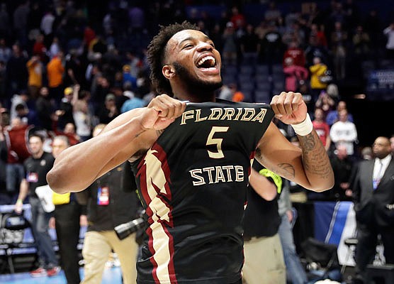 Florida State guard PJ Savoy celebrates after Sunday night's 75-70 win against top-seeded Xavier in Nashville, Tenn.