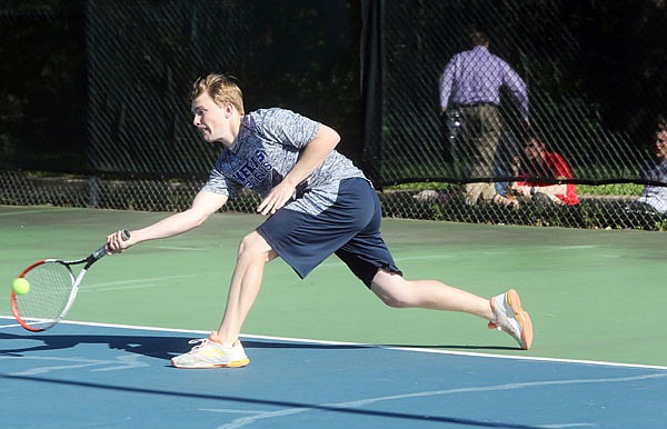 Seth Pezley of Helias lunges for the ball during a match last season at Washington Park.