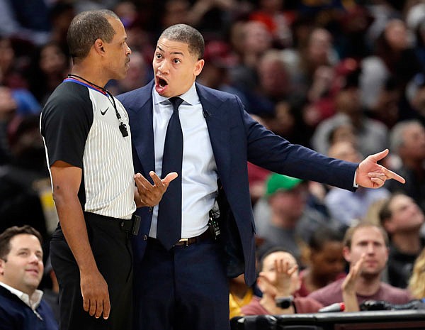 Cavaliers head coach Tyronn Lue argues with official Eric Lewis during the first half of a game earlier this month against the 76ers in Cleveland.