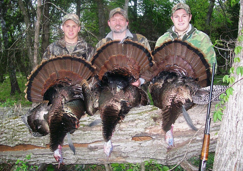 Mike Hubbard, center, will fill the role of deputy director of resource management at the Missouri Department of Conservation in June 2018. Mike is pictured with his two sons — Caleb Kinkead, left, and Carter Kinkead, right — after a day of turkey hunting near Warsaw.