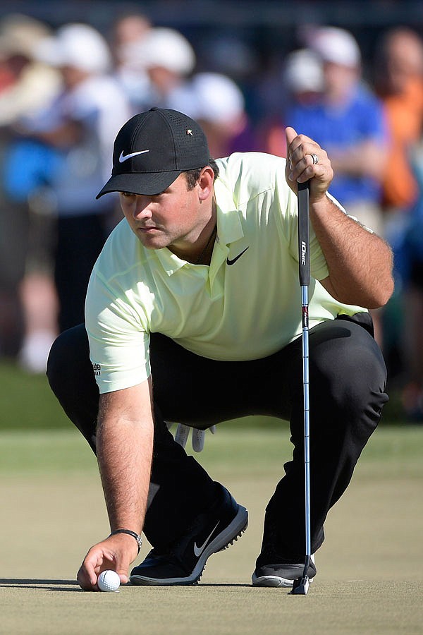 Patrick Reed lines up a putt on the 14th green during Friday's second round of the Arnold Palmer Invitational in Orlando, Fla.