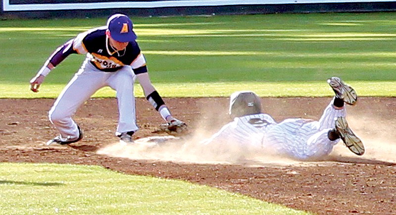 Ashdown second baseman Blake Ritter tags out Pleasant Grove's Andrew LeGrand, who was attempting to stretch a hit into a double, Monday at Hawk Field.