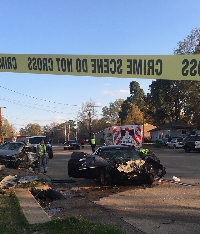 Crime scene tape blocks part of Richmond Road after a fatal vehicle accident on Monday at Richmond and Wheeler. A Texarkana, Ark., woman was killed in the accident.