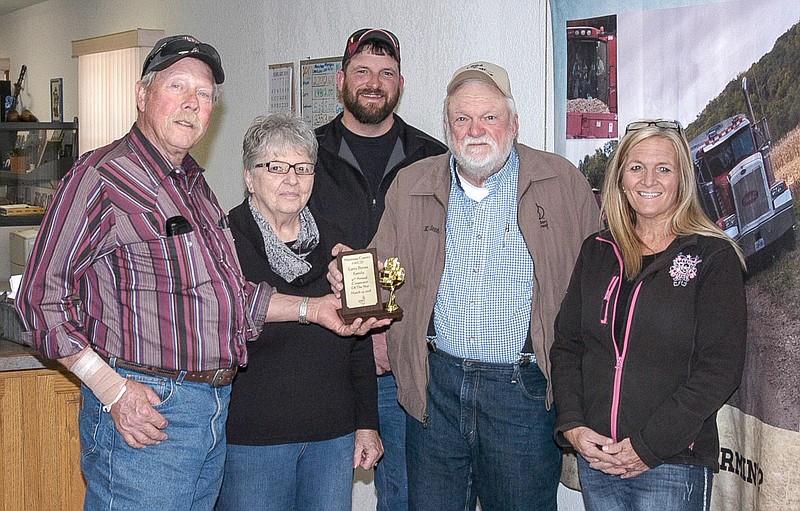 Tom Harris, chairman of the Moniteau County Soil and Water Conservation District Board of Supervisors, presents the 2017 Cooperator of the Year award to Larry Petree. From left, are Harris, Carleen Petree, Grant Petree, Larry Petree and Carmen Nolting.