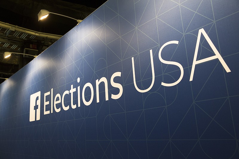 FILE- In this Aug. 6, 2015, file photo, FaceBook elections signs stand in the media area in Cleveland, Thursday, before the first Republican presidential debate. Breaking more than four days of silence, Zuckerberg admitted mistakes and outlined steps to protect user data in light of a privacy scandal involving a Trump-connected data-mining firm. Zuckerberg posted on his Facebook page Wednesday, March 21, 2018, that Facebook has a "responsibility" to protect its users' data. (AP Photo/John Minchillo, File)