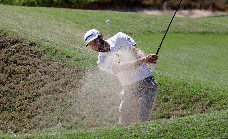 Dustin Johnson plays a shot from a bunker on the third hole during a practice round at the Dell Technologies Match Play golf tournament at the Austin Country Club, Tuesday, March 20, 2018, in Austin, Texas. (AP Photo/Eric Gay)