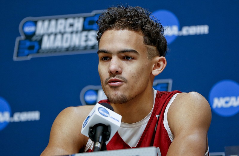 FILE - In this March 13, 2018, file photo, Oklahoma's Trae Young answers questions during a news conference for an NCAA college basketball first round game in Pittsburgh. Oklahoma star freshman Trae Young is leaving for the NBA after a standout season. The 6-foot-2 guard averaged 27.4 points and 8.7 assists this season, and many projections have him going early in the first round. He posted the reasons for his decision on ESPN early Tuesday, March 20, 2018, saying he was ready to put in the work needed to play in the NBA. (AP Photo/Keith Srakocic, File)