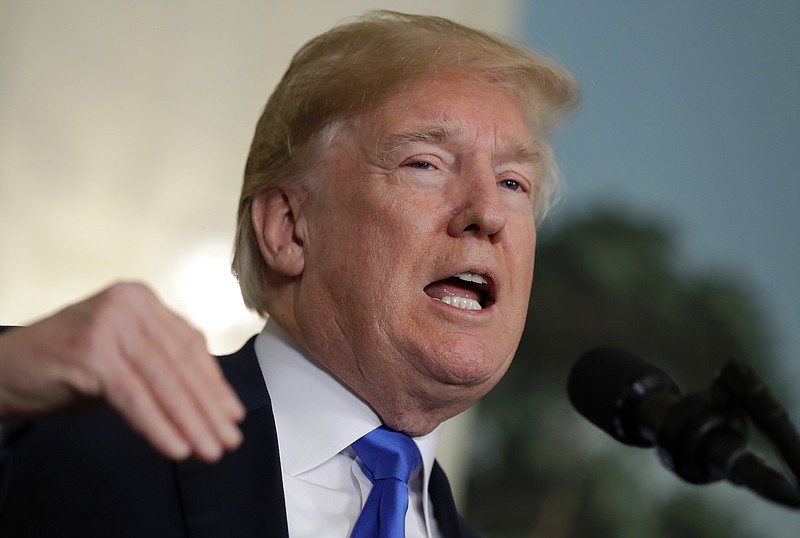 President Donald Trump speaks before he signs a presidential memorandum imposing tariffs and investment restrictions on China in the Diplomatic Reception Room of the White House, Thursday, March 22, 2018, in Washington. (AP Photo/Evan Vucci)