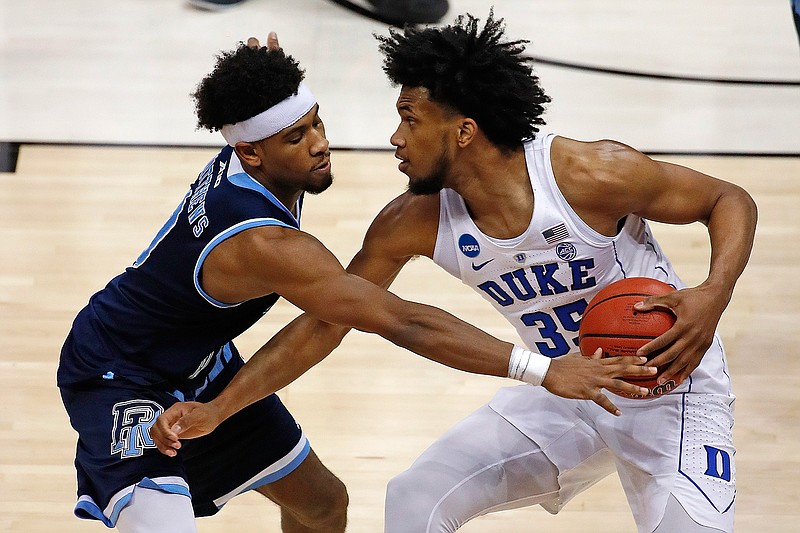 Duke's Marvin Bagley III (35) is defended by Rhode Island's E.C. Matthews during the second half of an NCAA men's college basketball tournament second-round game March 17 in Pittsburgh. Duke won, 87-62.