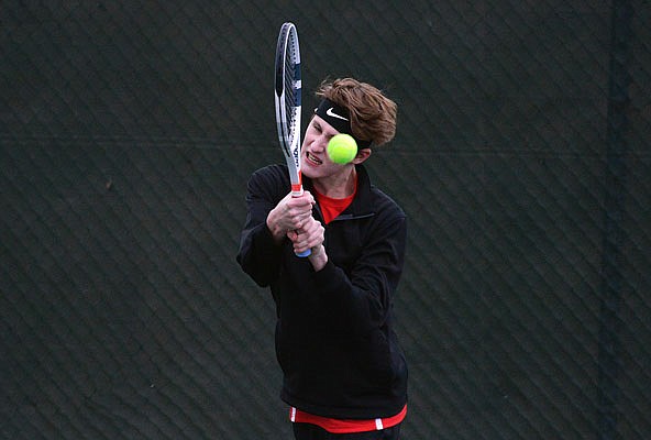 Karsten McMillan of Jefferson City keeps his eye on the ball on a return during Wednesday's dual against Waynesville at Washington Park.