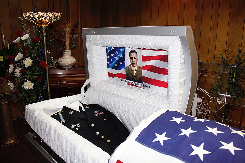 Army Pvt. Rudolph "Rudy" Johnson's casket sits open before his funeral Thursday at Hicks Memorial Chapel in Hope, Ark. Johnson died fighting in Italy during World War II, but his remains were identified only recently.
