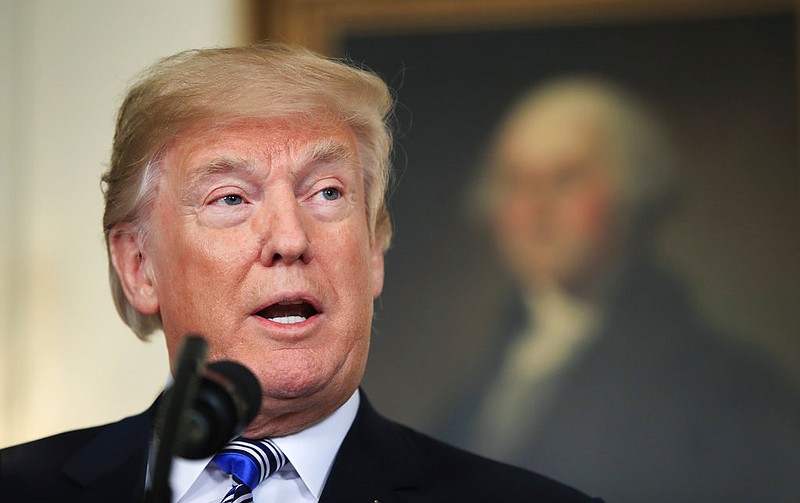 President Donald Trump speaks in the Diplomatic Room of the White House in Washington, Friday, March 23, 2018, about the $1.3 trillion spending bill.