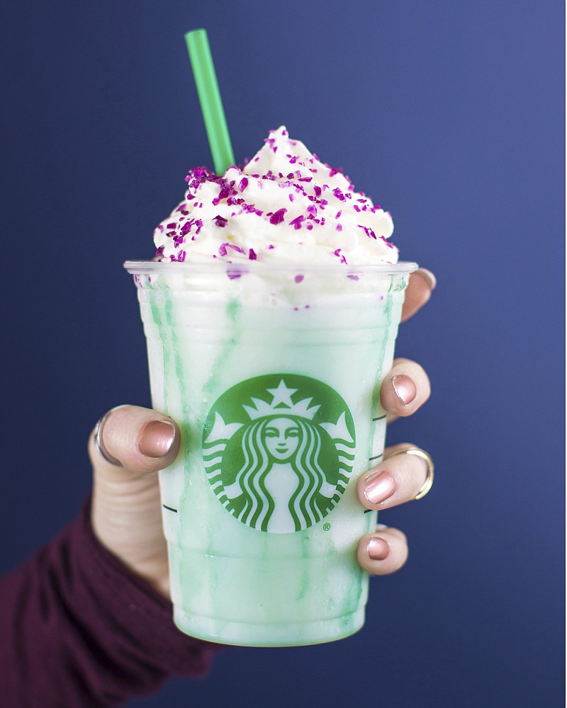 In this undated photo released by Edelman, U.S. Starbucks Coffee Company displays a new Crystal Ball Frappuccino Purple beverage. (Courtesy of Edelman via AP)