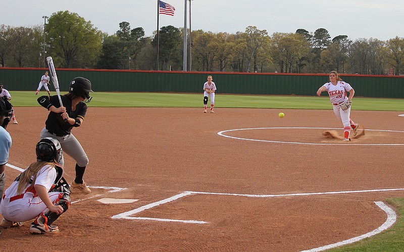 Texas High pitcher Mabry Smith throws a pitch to Mount Pleasant batter Blakely Cheek for a strikeout during a District 16-5A softball game Friday at Lady Tiger Field. Kylee Spriggs is the THS catcher.