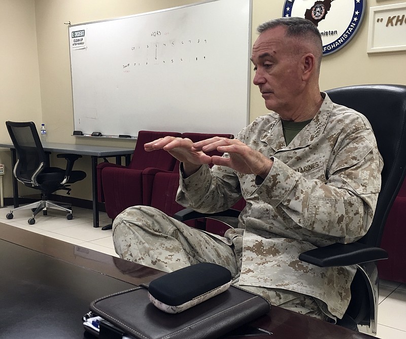 Marine Gen. Joseph Dunford, chairman of the Joint Chiefs of Staff, speaks to the media at Bagram Air Base in Afghanistan on March 21, 2018. Dunford says he's optimistic about Afghanistan after visiting the country this week. (AP Photo/Lolita Baldor)