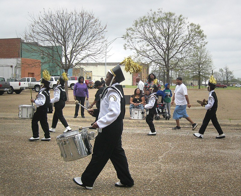 Stompers Drum Line proceeds before spectators Saturday during the 27th annual Twin Cities Black History Month Parade. The Twin Cities Black History Association held the parade after having to reschedule the event, planned for Feb. 24, because of rain.