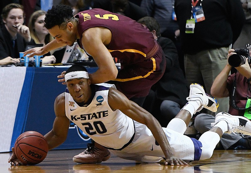 Kansas State forward Xavier Sneed (20) and Loyola-Chicago guard Marques Townes (5) vie for a loose ball during the second half of a regional final NCAA college basketball tournament game, Saturday, March 24, 2018, in Atlanta. (AP Photo/John Amis)
