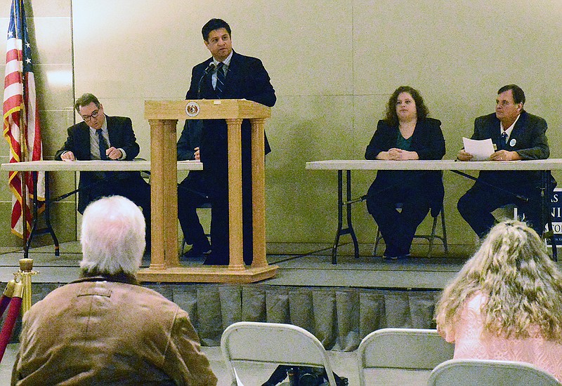 John Farmer de la Torre speaks Tuesday at the Capitol along with fellow Democratic candidates for Congress who signed "Our Promise to America," which promises to offer a bold vision that stands in contrast to the Republican agenda. In the background are Winston Apple, John Messner, Angelica Earl and Vince Jennings.