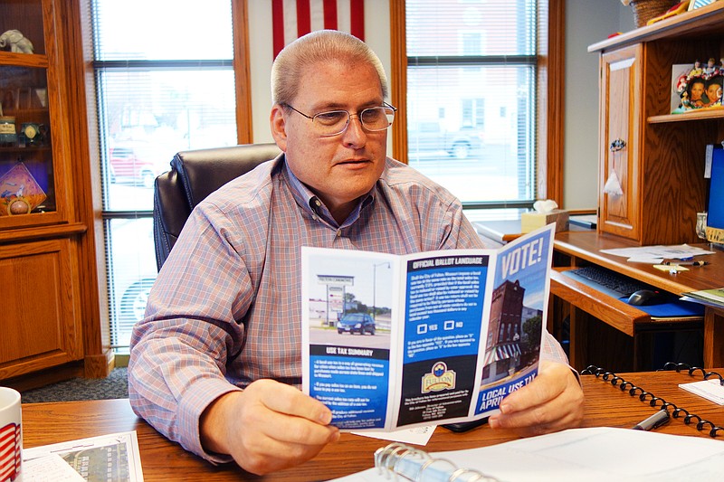 <p>Helen Wilbers/For the News Tribune</p><p>Fulton City Administrator Bill Johnson reviews a pamphlet abut the proposed city use tax, which will be on the ballot Tuesday. If passed, it would impose a 2.5 percent tax on goods purchased by Fulton residents from out-of-state vendors.</p>