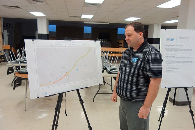 MoDOT Project Manager Troy Hughes views a detour map of the Route 17 bridge repair project.