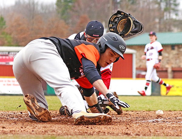 Eric Kane of Waynesville scores on a double steal during the third inning of Wednesday's game against Jefferson City at Vivion Field. 