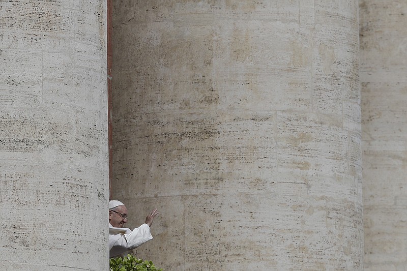 Pope Francis delivers his Urbi et Orbi (to the city and to the world) message from the main balcony of St. Peter's Basilica, at the Vatican, Sunday, April 1, 2018. (AP Photo/Gregorio Borgia)