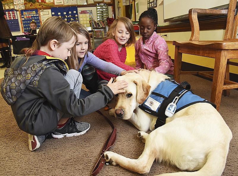 West School students in Rebekah Walker's second-grade class were introduced to the school's newest four-legged staff member named Parker. He works for attention, mostly petting, but will also accept hugs.