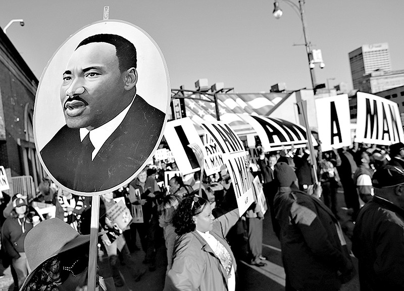 People gather Wednesday in Memphis, Tenn., to mark the 50th anniversary of the assassination of the Rev. Martin Luther King Jr. King was assassinated April 4, 1968, while in Memphis to support striking sanitation workers.