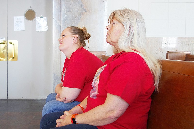 Murder victim Dayne Hathman's mother Ladaynea Spencer, left, and grandmother Laura Armstrong listen closely during a post-trial relief hearing for Scottie Willet, who pleaded guilty to the crime in 2014. Both wore T-shirts demanding justice for Dayne.