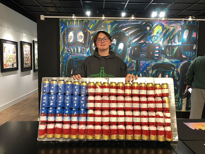 Levi Yoder, seventh-grader at Lighthouse Prepatory Academy, showcases his original artwork, "Ameri-CAN-flag," that won first place in the Jefferson City Museum of Modern Art's youth art contest.