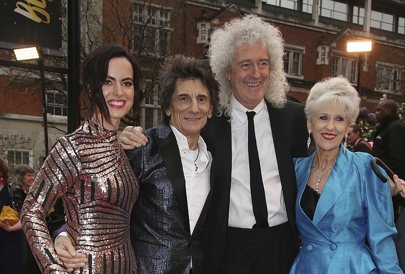 Sally Wood, from left, musicians Ronnie Wood, Brian May and actress Anita Dobson pose for photographers upon arrival at the Olivier Awards in London, Sunday, April 8, 2018. (Photo by Joel C Ryan/Invision/AP)