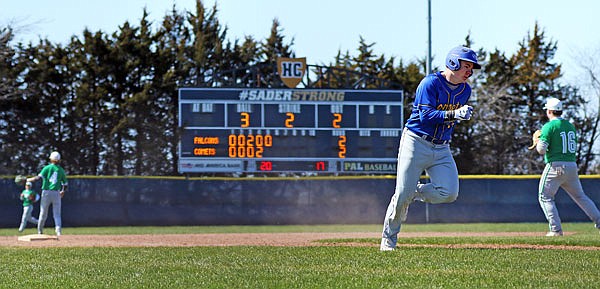 Josef Keilholz of Fatima sprints toward home plate to score a run during the fifth inning of Saturday's fifth-place game of the Capital City Invitational against Blair Oaks at the American Legion Post 5 Sports Complex.
