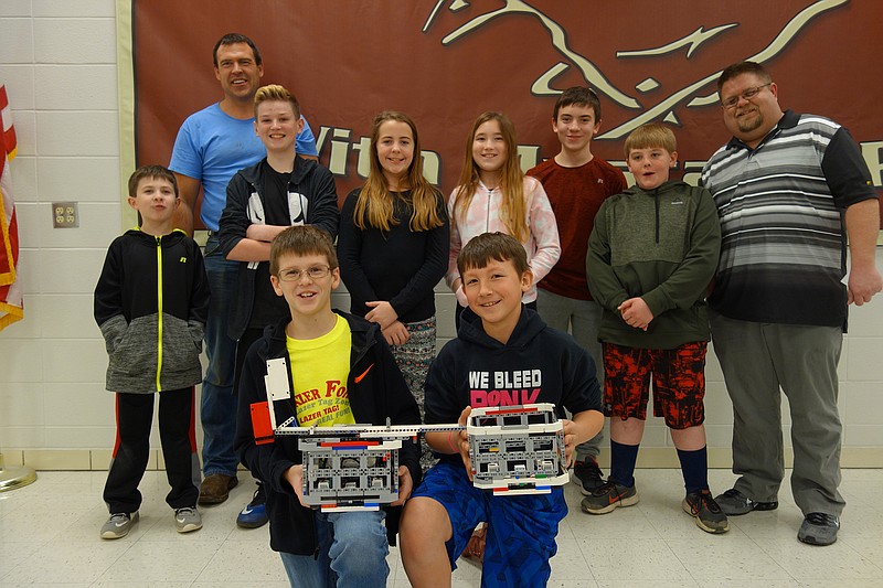 <p>Allen Fennewald/News Tribune</p><p>RoboH20 team members, from left, are Brenner Johnson, mentor Marty Graham, Devin Rabold, Luke Graham, Mallory Witt, Nevaeh Melendez, Bradon Wrye, Zachary Smithson, Jerry Kaibel and instructor Jerry Barsby.</p>