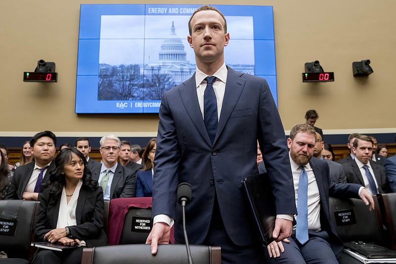 Facebook CEO Mark Zuckerberg arrives to testify before a House Energy and Commerce hearing on Capitol Hill in Washington, Wednesday, April 11, 2018, about the use of Facebook data to target American voters in the 2016 election and data privacy. (AP Photo/Andrew Harnik)