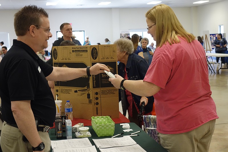 <p>Jenny Gray/
FULTON SUN</p><p>Patty Franklin, of Fulton, won a free tube of Biofreeze on Thursday at the Callaway Senior Expo. The gift was given to her by Bob Czarnecki of Select Physical Therapy.</p>