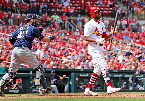 Brewers catcher Jett Bandy celebrates as Dexter Fowler of the Cardinals strikes out to end Wednesday afternoon's game at Busch Stadium.