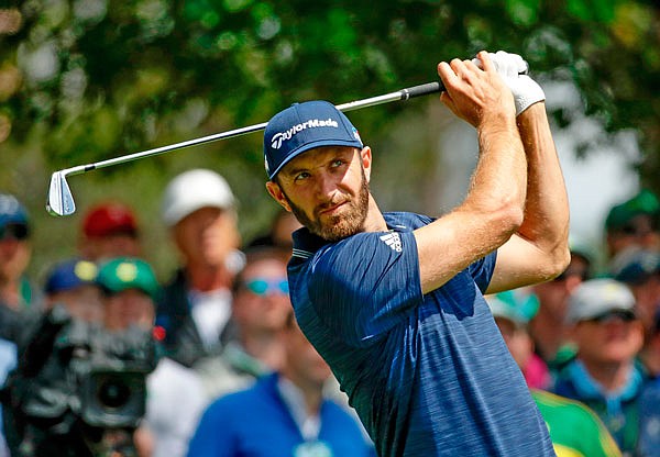 Dustin Johnson hits on the fourth hole during Sunday's final round at the Masters in Augusta, Ga.