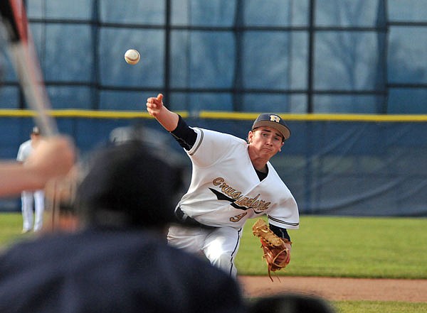 Helias pitcher Dawson Meyer delivers to the plate during Wednesday night's game against St. Dominic at the American Legion Post 5 Sports Complex.