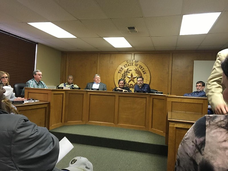 The New Boston City Council is seated for a special meeting Friday, April 6, 2018 in New Boston, Texas. From left are City Secretary Darla Faulknor, Councilman Greg Harmon, Councilman Richard Ellis, City Attorney Mike Brock, Mayor Johnny Branson, Councilman Joe Dike and Councilman David Turner. Councilman Jackie Laney is not pictured.