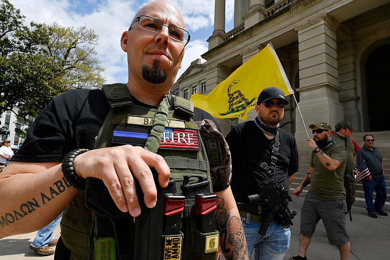 Shaun Baby, of Cartersville, Ga., participates in a gun-rights rally at the state capitol, Saturday, April 14, 2018, in Atlanta.  About 40 gun rights supporters have gathered for one of dozens of rallies planned at statehouses across the U.S.  (AP Photo/Mike Stewart)