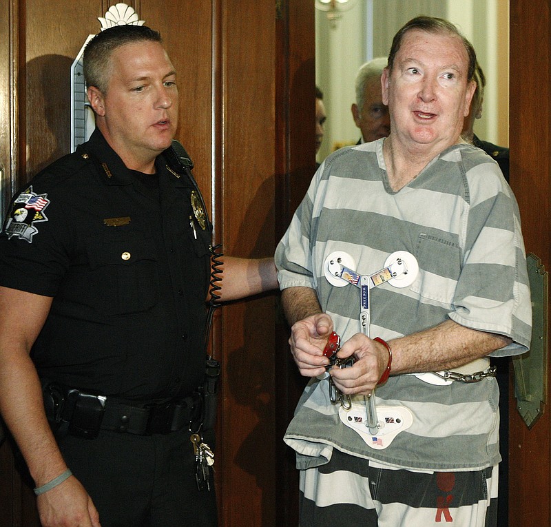 FILE - In this Monday, July 11, 2011 file photo, Jerome Ersland, right, is led from an Oklahoma County courtroom after he was sentenced to life with the possibility of parole for the May 2009 shooting of 16-year-old Antwun Parker, in Oklahoma City. On Monday, Ersland will request commutation of the life prison sentence. (AP Photo/Sue Ogrocki, File)