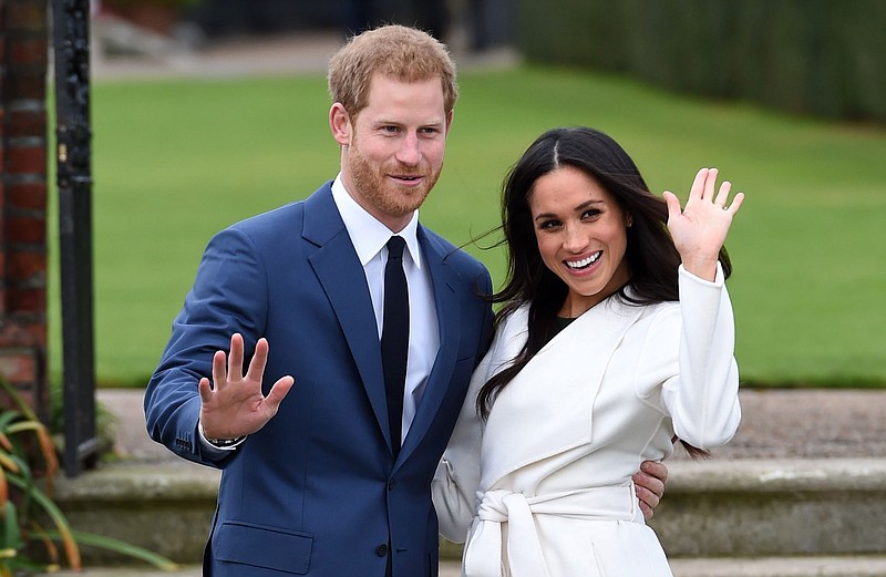 In this Nov. 27, 2017 file photo, engaged couple Britain's Prince Harry, left, and Meghan Markle pose for the media at Kensington Palace in London. The royal nuptials will take place on Saturday, May 19. (Eddie Mulholland/Pool via AP)