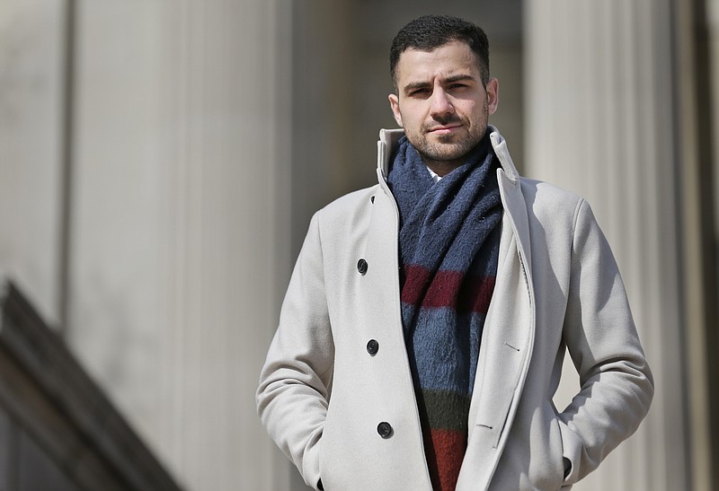 In this April 2, 2018 photo, Qutaiba Idlbi poses for a picture at Columbia University in New York where he is a sophomore. A scholarship program that Columbia created to support Syrians who, like Idlbi, were displaced by war, could be jeopardized by the travel restrictions that President Trump has imposed on citizens of that country. (AP Photo/Seth Wenig)