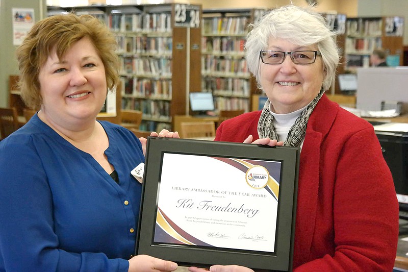 Missouri River Regional Library Director Claudia Cook, left, awards Kit Freudenberg as library ambassador April 6 at MRRL. 