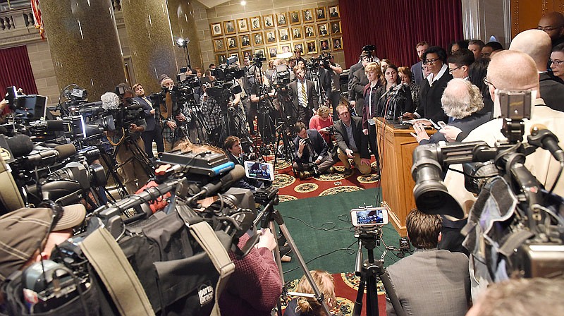 Missouri House Democrats, headed by Minority Floor Leader Rep. Gail McCann Beatty, at microphones, addresses a large media crowd in the House of Representatives side gallery April 11, 2018, following the release of the report from the special House committee investigating the St. Louis indictment of Gov. Eric Greitens on an invasion-of-privacy charge. 